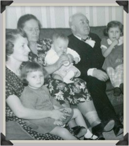 Mom, Babci, Dziadzi, my two sisters and me (the baby on Babci's lao), 1951.
